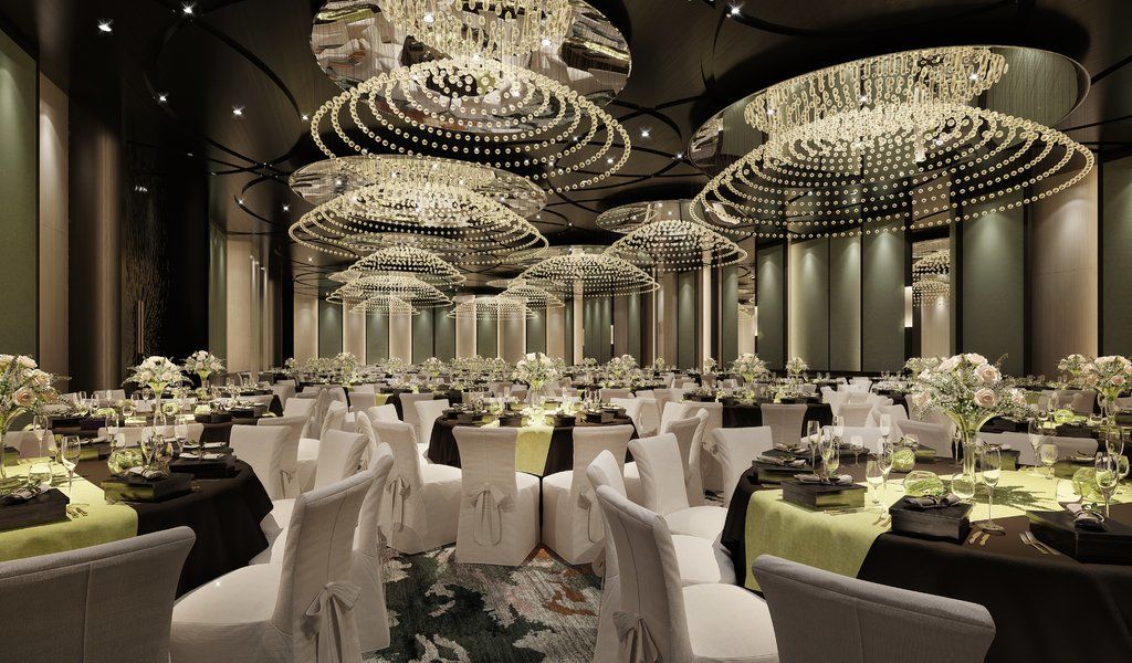 Caesar Park Hotel Banqiao Taipei Exterior photo The photo shows an elegant banquet room set up for an event. The space features multiple round tables adorned with dark and light tablecloths, each set with fine dining ware and centerpieces that include flowers. The room is illuminated by large, daz